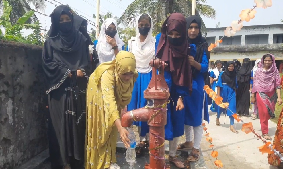 Students of Rampal Pilot Girls’ High School drinking water from the newly inaugurated tube well. Photo: AH Sumon/V7N